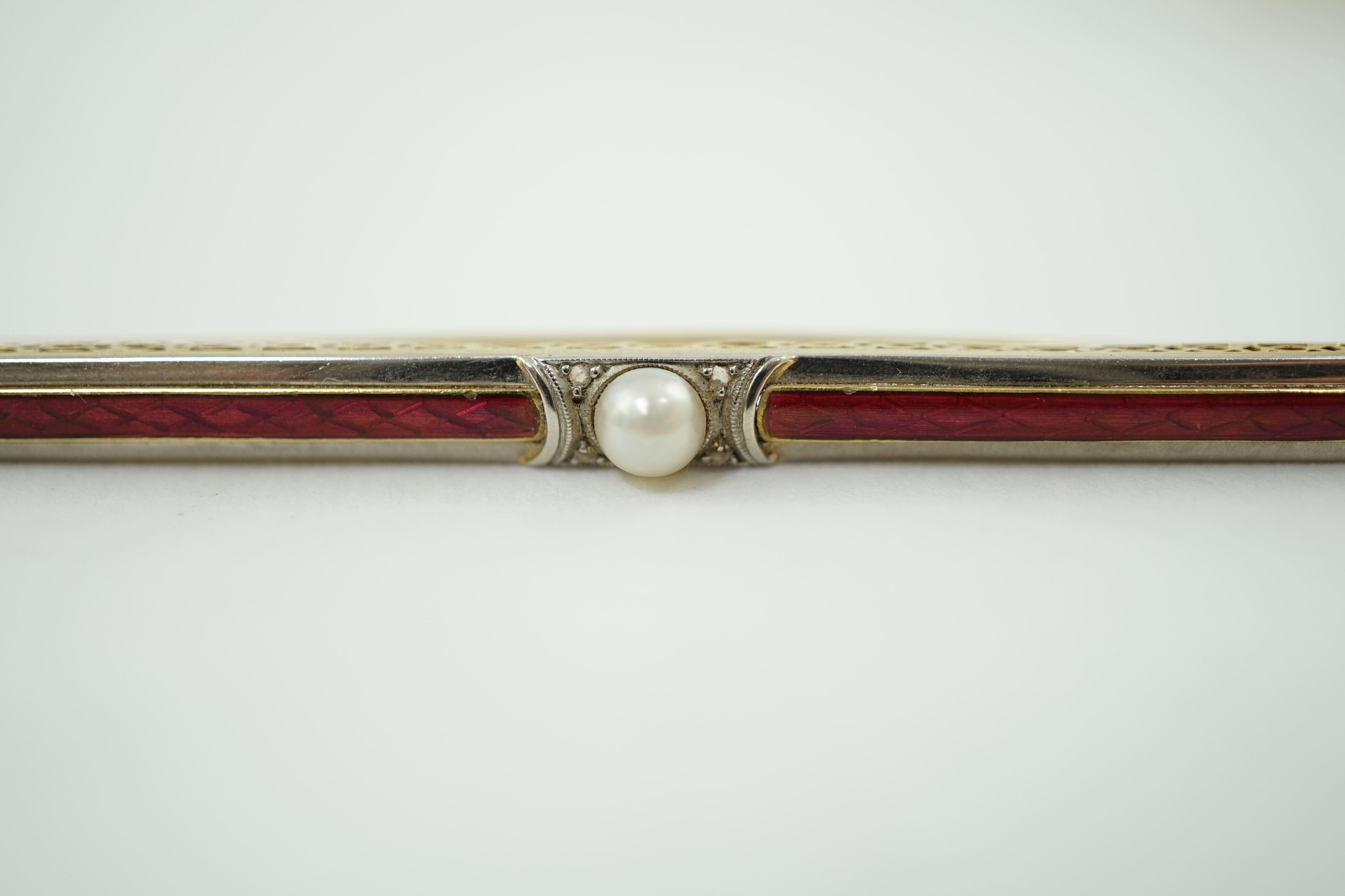 A 1940's 18ct gold, enamel, diamond chip and split pearl set bar brooch